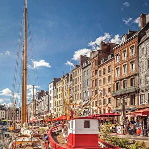Sailing boats and fishing boat in the old port of Honfleur, Calvados, Normandy, France