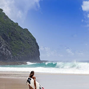 South America, Brazil, Pernambuco, Fernando de Noronha Island, surfer on Father s