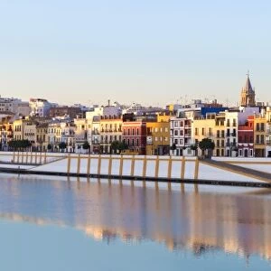 Spain, Andalusia, Seville. Triana district at sunrise with Guadalquivir river