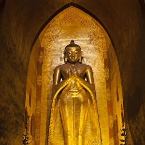 Standing Buddha gilded statue, Ananda Pahto temple, Bagan, Myanmar (Burma)