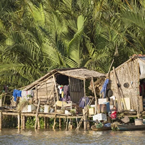 Stilt house on Ben Tre River, Ben Tre, Mekong Delta, Vietnam