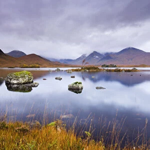 Stormy skies over Lochan Na H-Achlaise on Rannoch Moor in Autumn, Highlands, Scotland