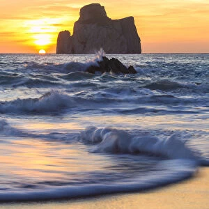 The sunset is reflected on the Beach of Masua, Iglesias, Sud Sardegna province, Sardinia