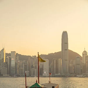 Tour boat in Victoria Harbour at sunset, Hong Kong Island, Hong Kong