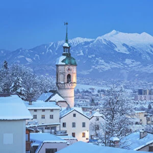 The tower of the old parish church of H√∂tting on a cold freezing evening, Innsbruck, Tyrol, Austria