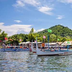 Traditional Bangka boats docked on on the shore of Taal Lake on Taal Volcano Island