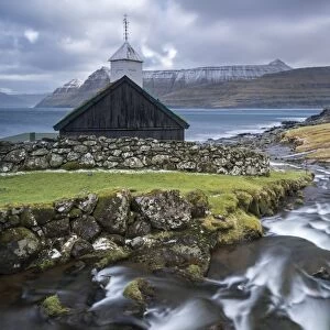 Traditional Faroese wooden turf roofed church in the village of Funningur on the island of Eysturoy