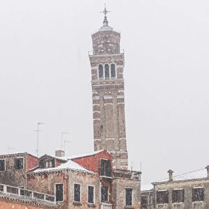 Venice, Veneto, Italy. The leaning bell tower of Santo Stefano under a snowfall