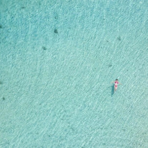 a vertical shot with beautiful girl enjoying the sea, Black River, Mauritius