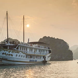 Vietnam, Halong Bay, tourist boats, dusk