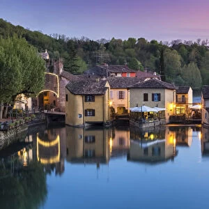 View of the medieval town of Borghetto sul Mincio at sunset