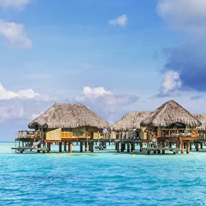 Water bungalows of Pearl beach resort in the lagoon of Bora Bora, French Polynesia