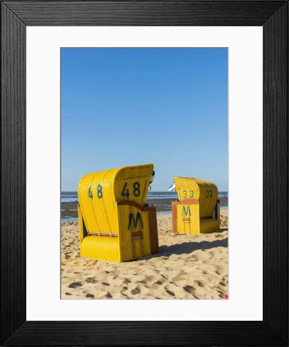 Framed Print : Duhnen, Cuxhaven, Lower Saxony, Germany. Yellow Strandkorbs along the Wadden Sea Framed Print : Duhnen, Cuxhaven, Lower Saxony, Germany. Yellow Strandkorbs along the Wadden Sea