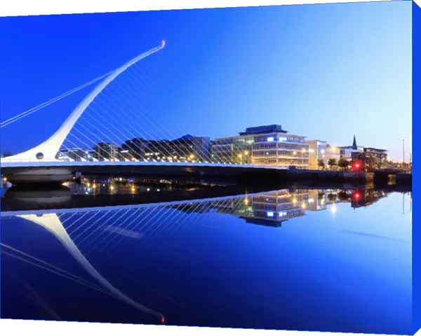 Europe, Dublin, Ireland, Samuel Beckett bridge by night reflecting on the Liffey river