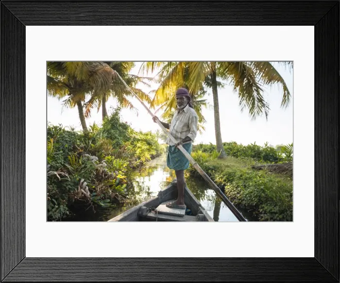 Framed Print : Anthony the boatman guiding the vessel through Keralan backwaters near North Paravoor Framed Print : Anthony the boatman guiding the vessel through Keralan backwaters near North Paravoor