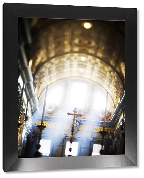 Italy, Rome, St. Peter Basilica interior with sun lights penetrating through the