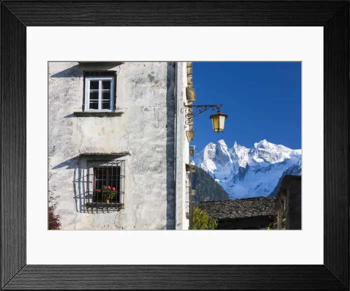 Framed Print : Typical alpine house and street lantern frame the snowy peaks Soglio Bregaglia Valley Framed Print : Typical alpine house and street lantern frame the snowy peaks Soglio Bregaglia Valley