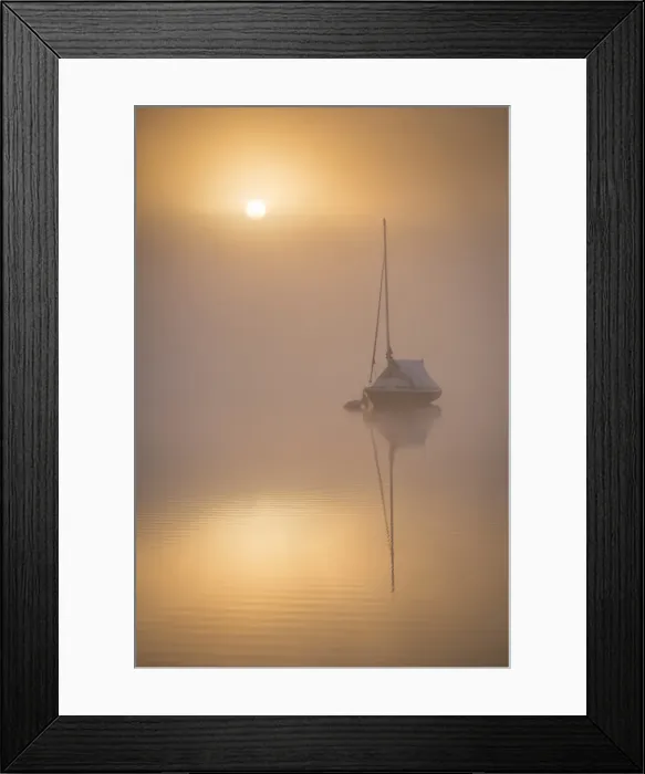 Framed Print : Sun rising over a sailing boat moored on a misty Wimbleball Lake, Exmoor National Park Framed Print : Sun rising over a sailing boat moored on a misty Wimbleball Lake, Exmoor National Park