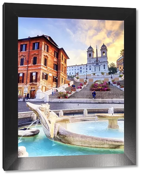 Italy, Rome, Trinita dei Monti stairs and Barcaccia fountain at Spain square at sunrise