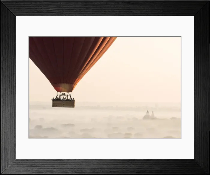 Framed Print : Hot air balloon flying over pagodas in Bagan, Myanmar Framed Print : Hot air balloon flying over pagodas in Bagan, Myanmar