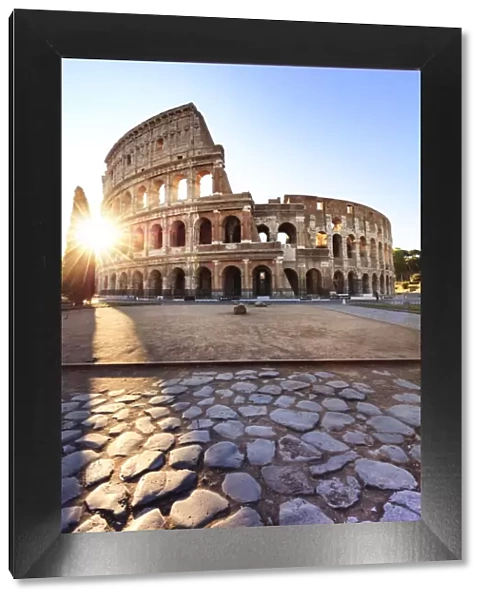 Italy, Rome, Colosseum and Roman Forum at sunrise