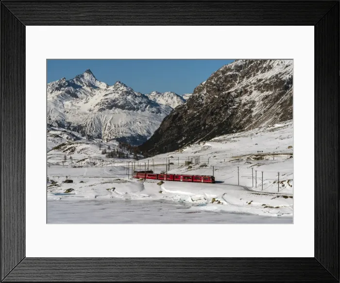 Framed Print : The famous Bernina Express red train passing Lago Bianco in a scenic winter mountain landscape Framed Print : The famous Bernina Express red train passing Lago Bianco in a scenic winter mountain landscape