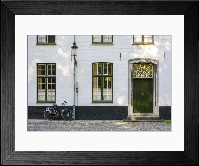 Framed Print : Belgium, West Flanders (Vlaanderen), Bruges (Brugge). Bicycle next to a house in the Begijnhof