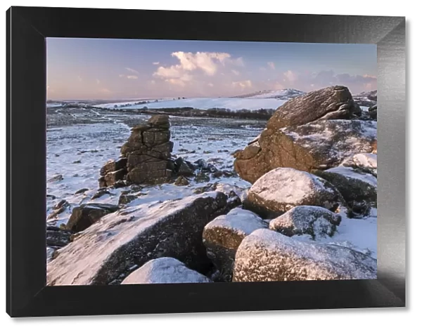 Snow dusted granite outcrops on Hound Tor, Dartmoor National Park, Devon, England