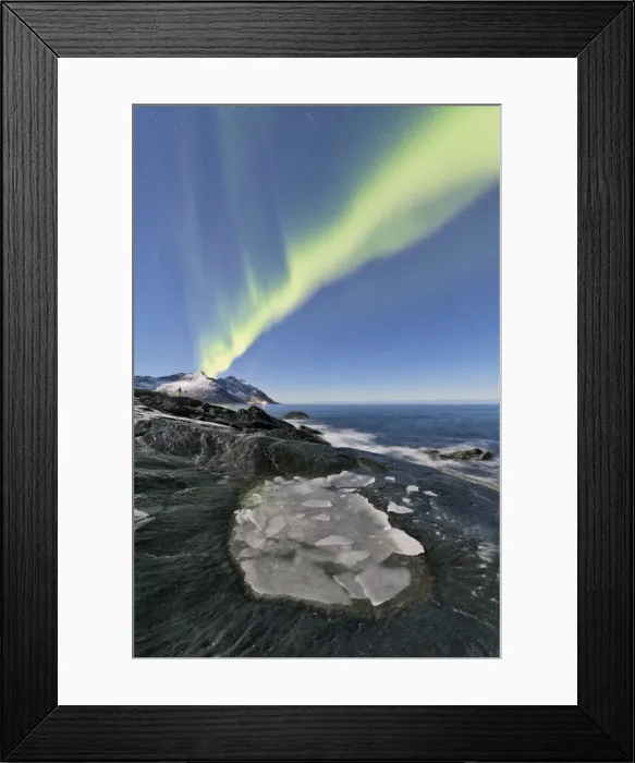 Framed Print : The Northern Lights illuminates the rocky peaks and icy sea in the polar night Tungeneset