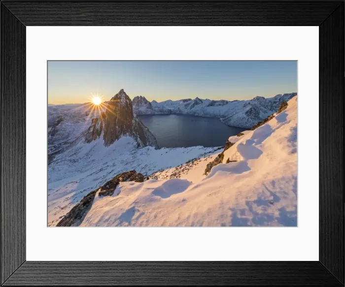 Framed Print : First lights of sunrise on Mount Segla and Mefjorden framed by the frozen sea seen Framed Print : First lights of sunrise on Mount Segla and Mefjorden framed by the frozen sea seen