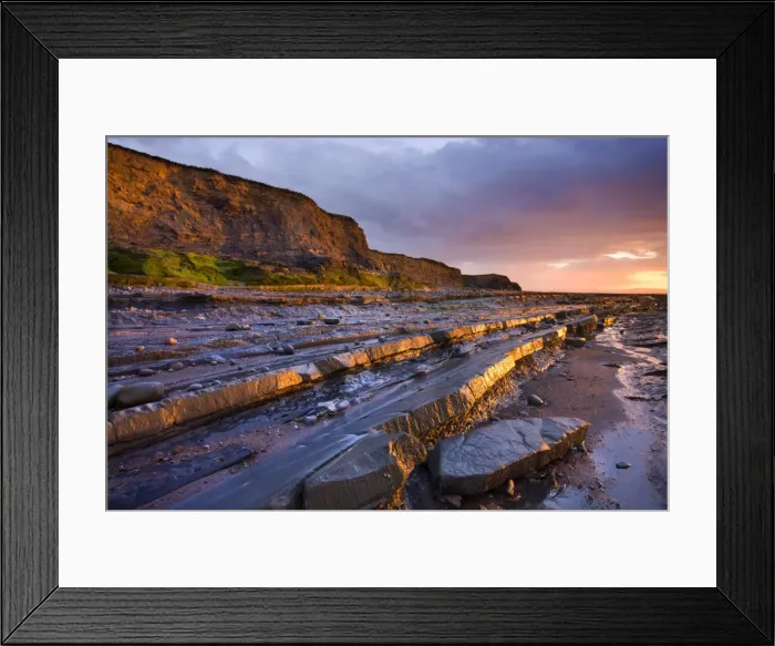 Framed Print : Late evening sunlight glows on the horizontal ledges of Kilve, Somerset, England Framed Print : Late evening sunlight glows on the horizontal ledges of Kilve, Somerset, England