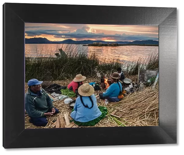 Native Uro Family dining at sunset, Uros Floating Islands, Lake Titicaca, Puno Region