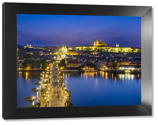 Czech Republic, Prague. Charles Bridge and Pague Castle on the Vltava River at dusk