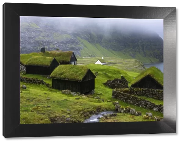 Saksun, Stremnoy island, Faroe Islands, Denmark. Iconic green roof houses