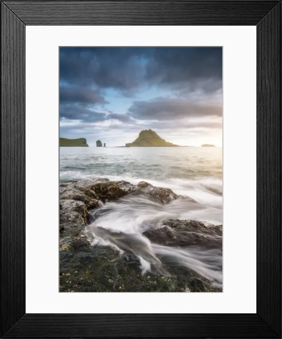 Framed Print : Vagar island, Faroe Islands, Denmark. Coastal rocks with Tinholmur islet at the background Framed Print : Vagar island, Faroe Islands, Denmark. Coastal rocks with Tinholmur islet at the background