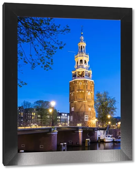 Netherlands, North Holland, Amsterdam. 16th century Montelbaanstoren tower on Oudeschans