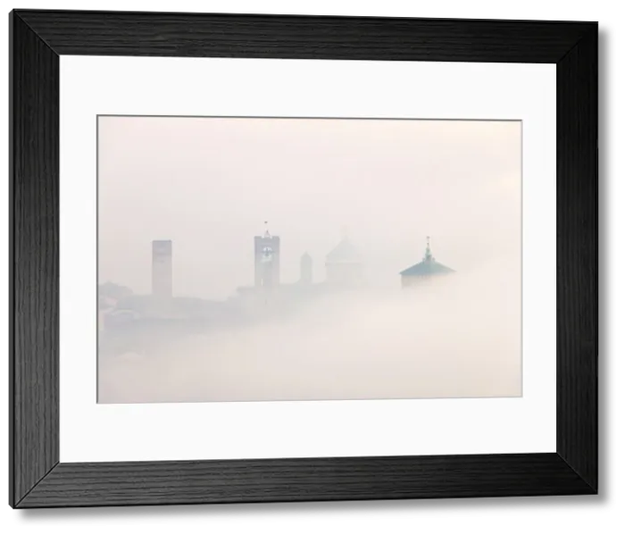 Framed Print : Bergamo Upper Town in the clouds. Bergamo Upper Town (Citta Alta), Bergamo province