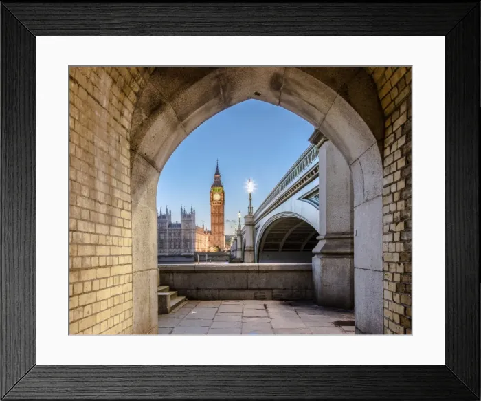 Framed Print : Night view of Big Ben and Westminster Palace from an old alley on the river bank Framed Print : Night view of Big Ben and Westminster Palace from an old alley on the river bank