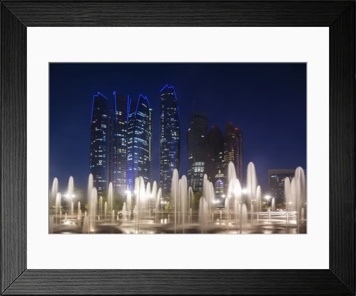Framed Print : UAE, Abu Dhabi, Emirates Palace Hotel fountains and Etihad Towers, dusk Framed Print : UAE, Abu Dhabi, Emirates Palace Hotel fountains and Etihad Towers, dusk