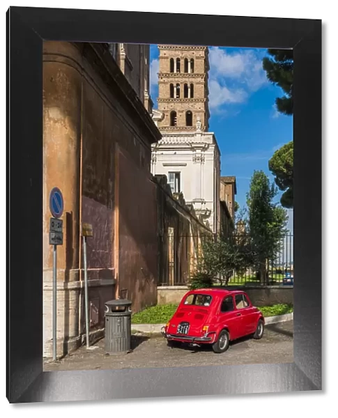 Old Fiat 500 car parked with Basilica dei Santi Bonifacio ed Alessio in the background