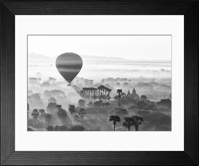 Framed Print : A hot air balloon flies over a trees and a temple at sunrise on a misty morning, Bagan Framed Print : A hot air balloon flies over a trees and a temple at sunrise on a misty morning, Bagan