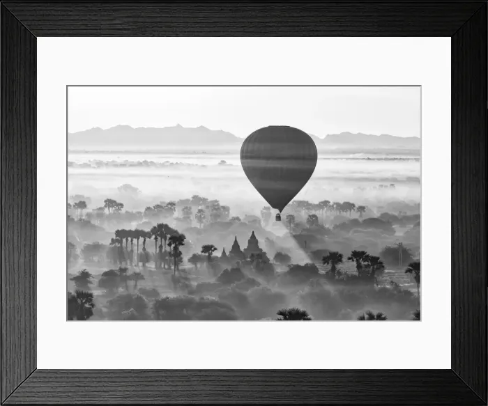 Framed Print : A hot air balloon flies over a trees and a temple at sunrise on a misty morning, Bagan Framed Print : A hot air balloon flies over a trees and a temple at sunrise on a misty morning, Bagan