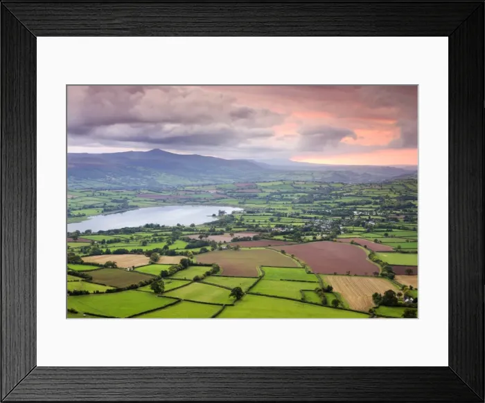 Framed Print : Pink sunset above the Brecon Beacons mountain range and rural countryside near Llangorse Framed Print : Pink sunset above the Brecon Beacons mountain range and rural countryside near Llangorse