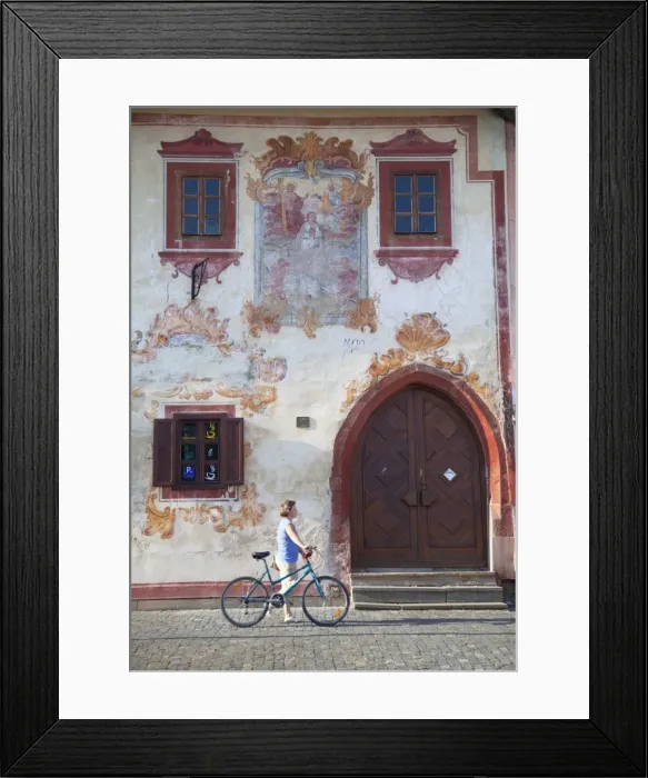 Framed Print : Woman walking past decorative building in Radnicne Square, Bardejov (UNESCO World Heritage Site)