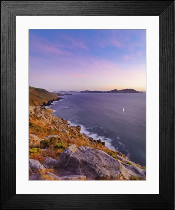 Framed Print : Spain, Galicia, Cangas, Yacht sailing in sea at dusk