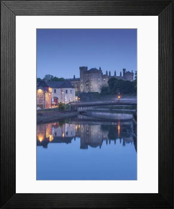 Framed Print : Ireland, County Kilkenny, Kilkenny City, pubs along River Nore and Kilkenny Castle, dusk Framed Print : Ireland, County Kilkenny, Kilkenny City, pubs along River Nore and Kilkenny Castle, dusk