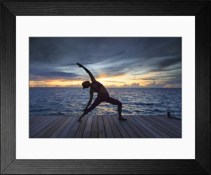 Framed Print : Maldives, South Ari Atoll, Thudufushi Island, Diamonds Thudufushi Resort, woman practising Framed Print : Maldives, South Ari Atoll, Thudufushi Island, Diamonds Thudufushi Resort, woman practising