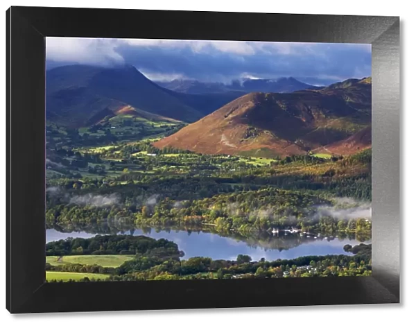Mountains and woodland form a backdrop to Derwent Water in the Lake District, Cumbria, England