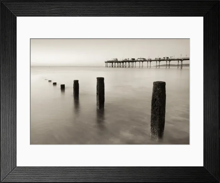 Framed Print : Teignmouth Pier and coastal defences at Teignmouth, South Devon, England. Summer