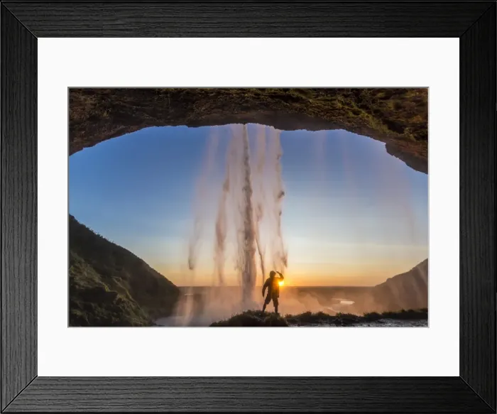 Framed Print : Man behind Seljalandsfoss Waterfall, Suourland (South Iceland), Iceland